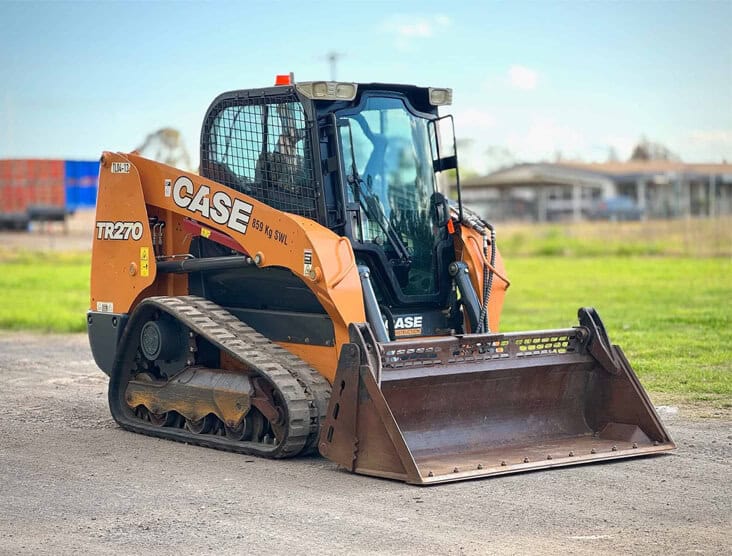 Compact track loader with front bucket, ideal for construction and landscaping projects.