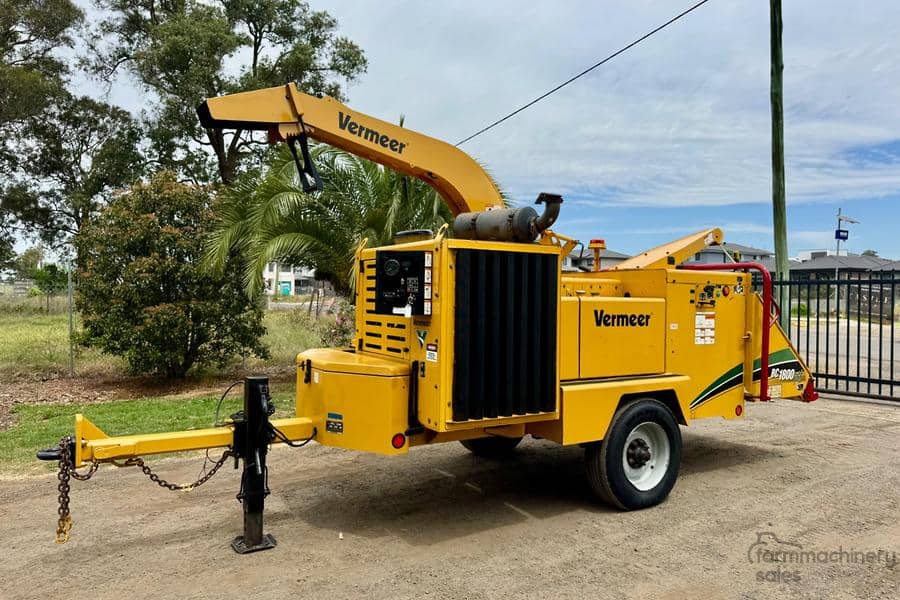 Vermeer BC1800XL wood chipper for efficient yard debris processing.