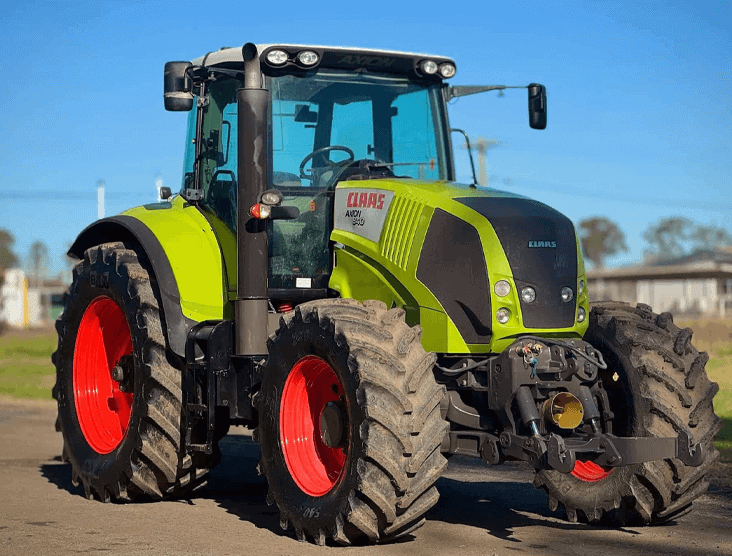 Farm tractor with CLAAS branding, suitable for farming and heavy-duty tasks.